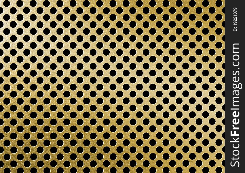 Close up of golden metal grille surface