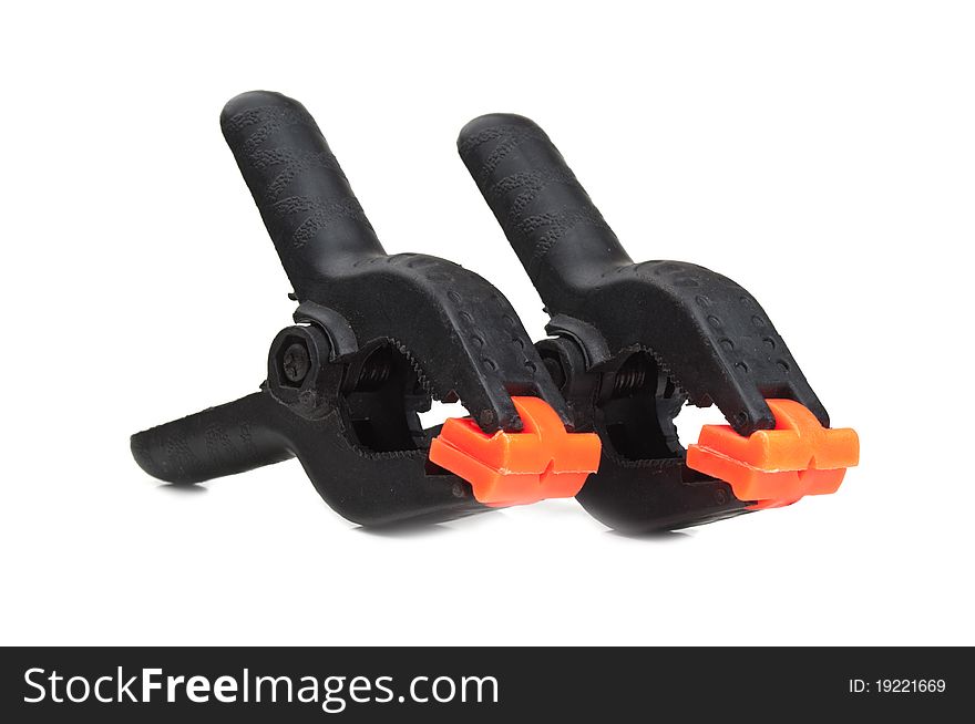 Two plastic and black clips isolated on a white background