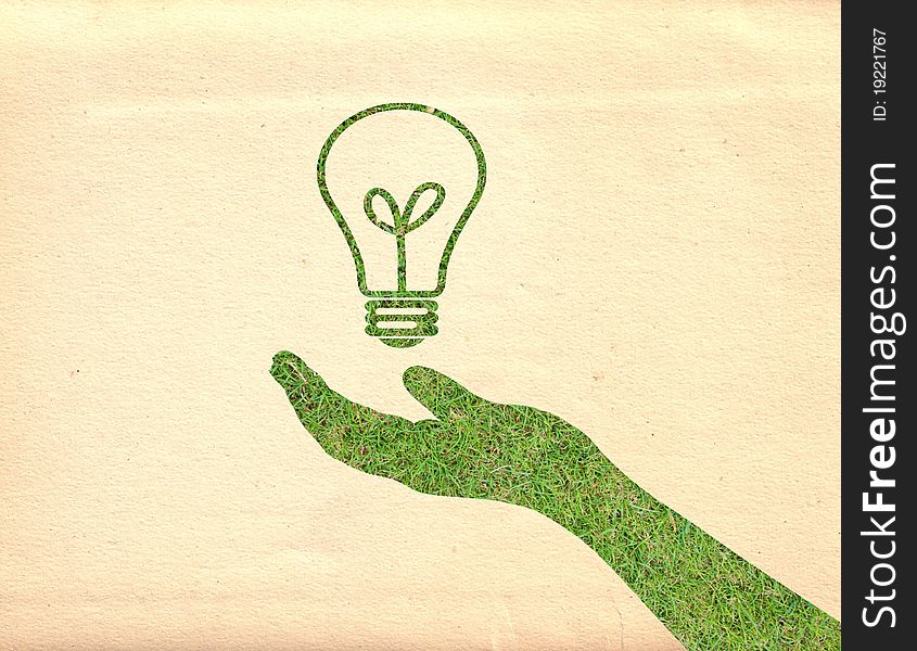 Hand and lightbulb on vintage paper