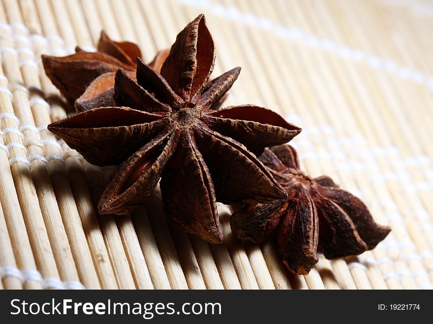 Close-up of star anise on wooden background.