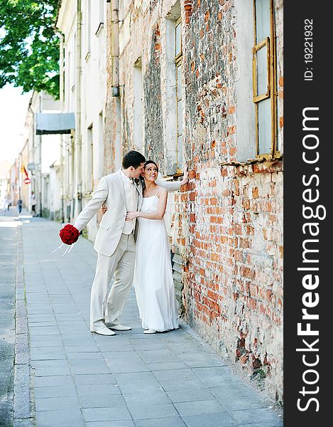 Bride and groom for an old brick wall. Bride and groom for an old brick wall