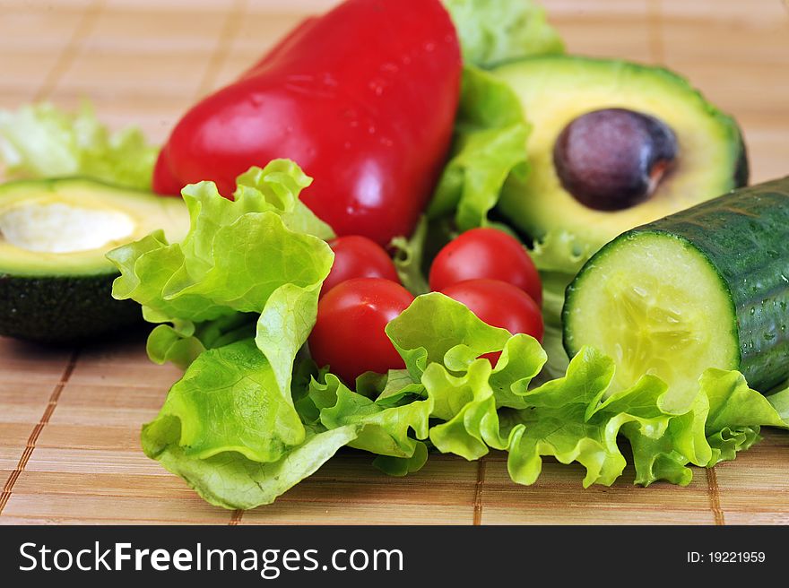 Ripe and juicy cherry tomatoes, avocado and lettuce