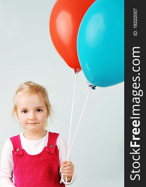 Beautiful little girl playing with balloons. Beautiful little girl playing with balloons