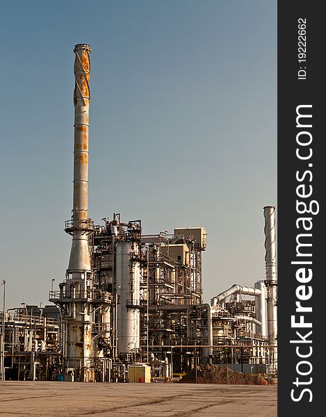 A petrochemical refinery plant with pipes and cooling towers