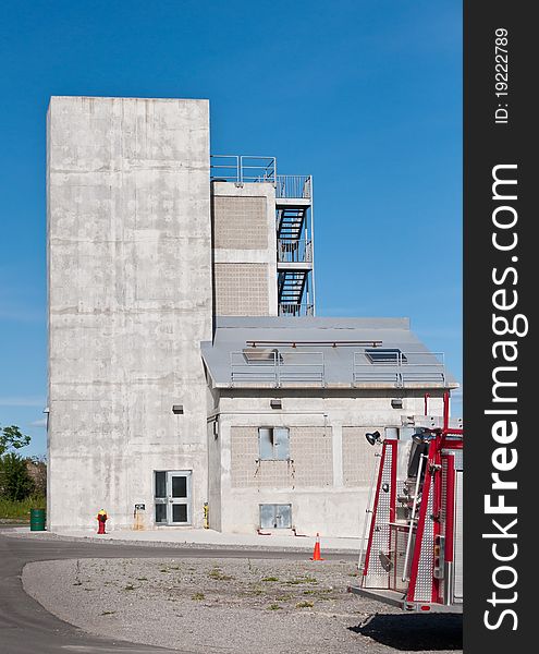 A concrete structure at a fire training facility allows firefighters to practice various scenarios.