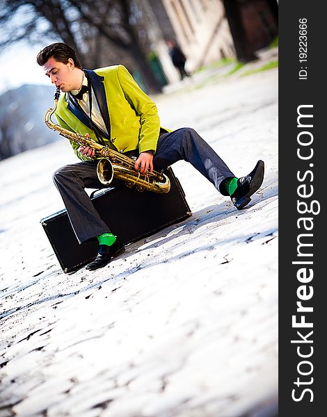 Man with a saxophone on the street