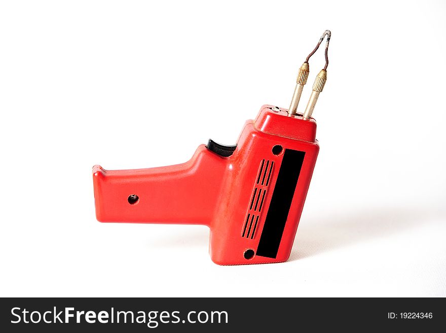 A red solder gun isolated on white background