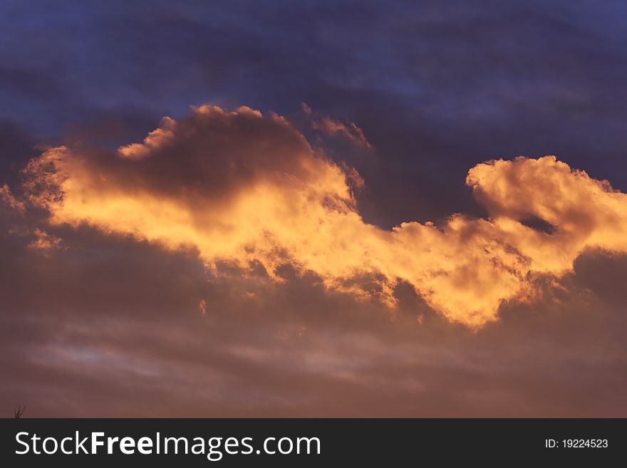 Cloudscape at sunset with colors in layers