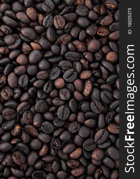 Many black coffee beans as background