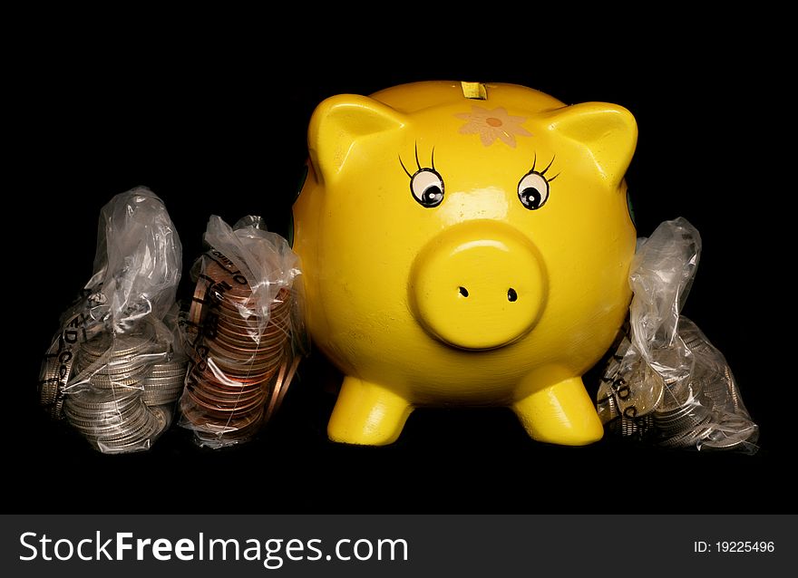 Yellow piggybank with sterling money studio cutout