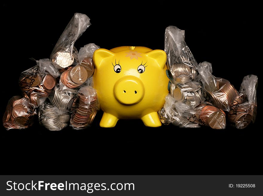 Yellow piggybank with sterling money studio cutout