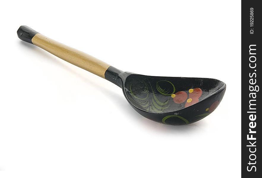 Decorated russian wooden spoon on the white