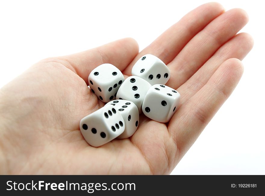 Hand holding dice isolated in white background. Hand holding dice isolated in white background