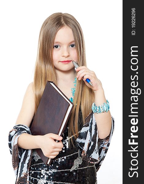 Portrait of little girl with a pencil and workbook