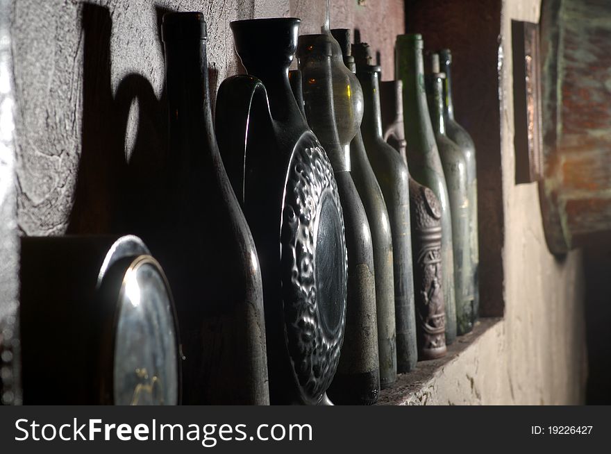 Vintage wine cellar with bottles of wine