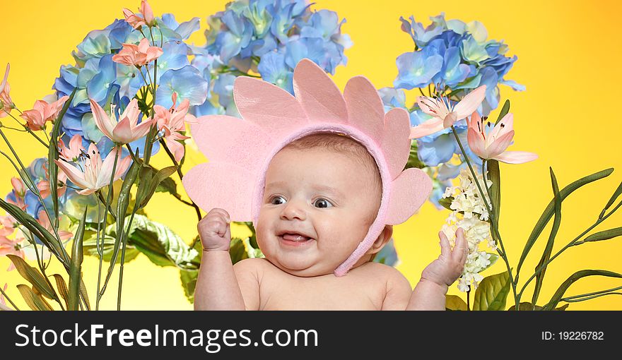 A little girl surrounded by flowers. A little girl surrounded by flowers