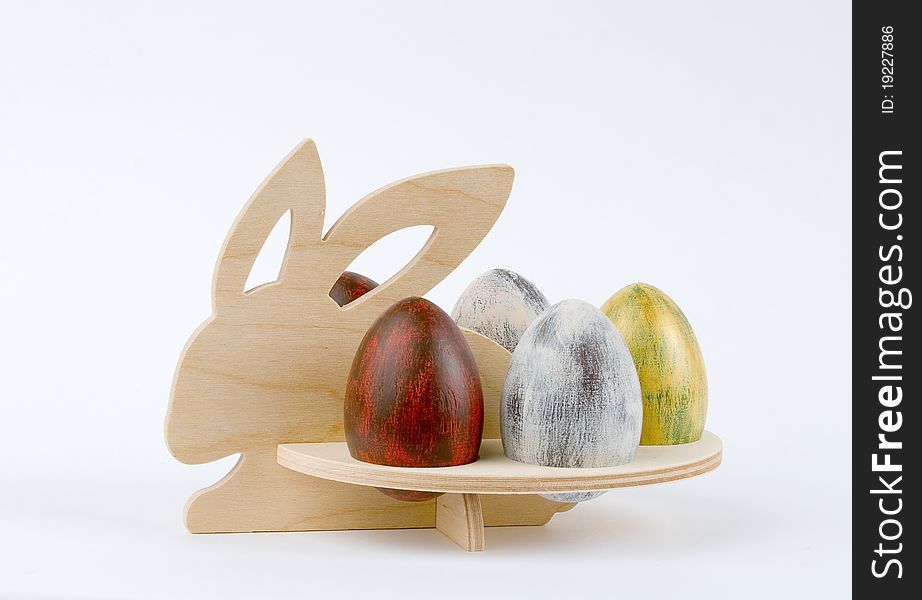 Easter wooden rabbit with eggs