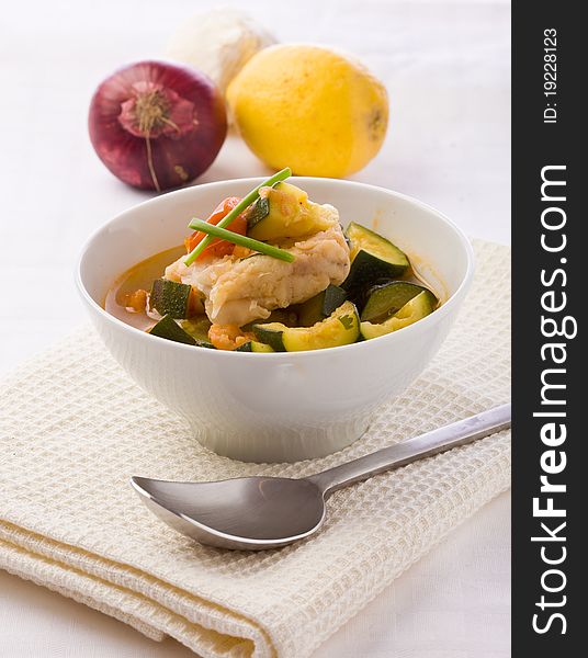 Photo of delicious fish soup with cod and zucchini