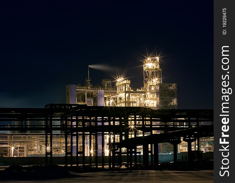 Lighted Refinery  In The Evening