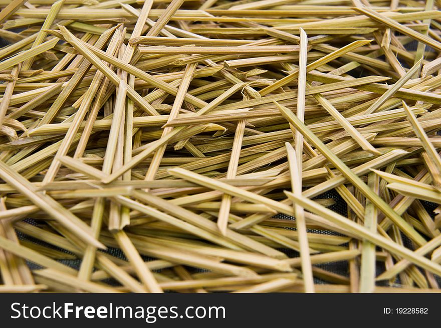 A pile of wooden skewers