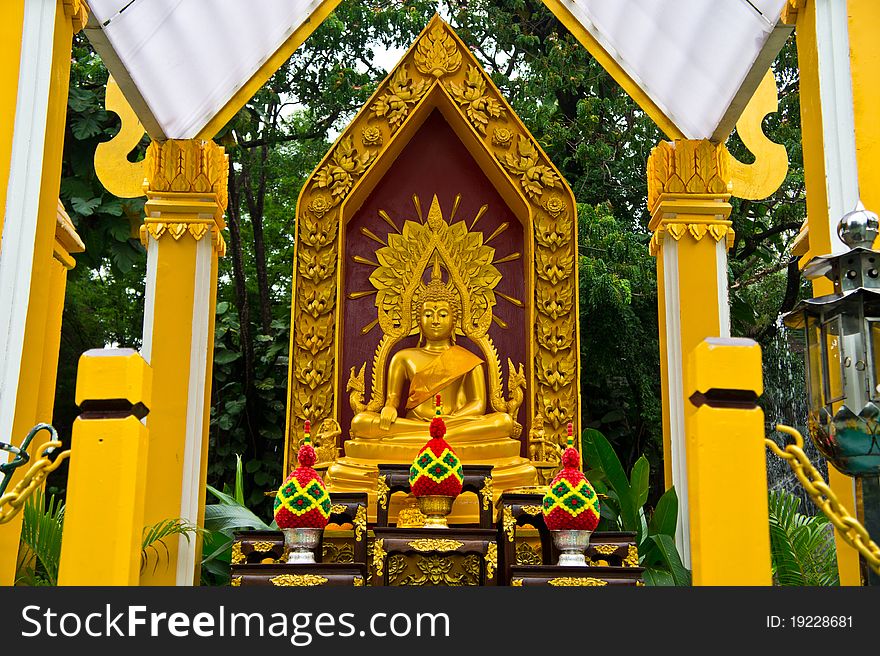 Beautiful golden buddha statue with a set of altar table