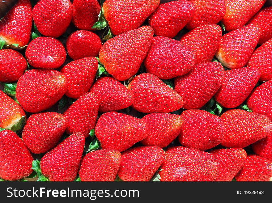 Basket of fresh strawberries, fruit background