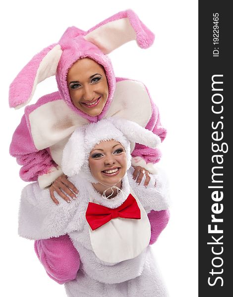 Pink rabbit jumping on white rabbit