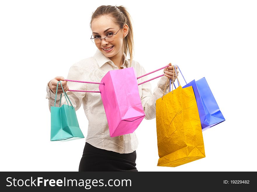 Businesswoman with shopping bags over white. Businesswoman with shopping bags over white