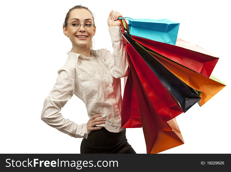 Businesswoman with shopping bags over white. Businesswoman with shopping bags over white