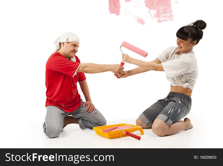 Workers preparing to painting a wall