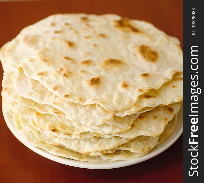 Stack of unleavened cakes on a plate. Stack of unleavened cakes on a plate