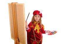 Little Girl With A Brush And Paints Royalty Free Stock Image