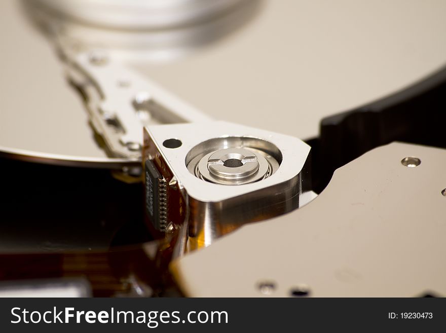 Close up of open hard disk drive, cylinders and heads