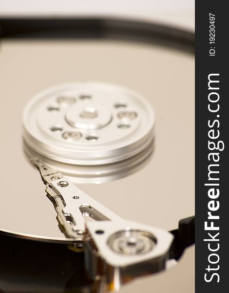 Close up of open hard disk drive, cylinders and heads, shallow depth of the field