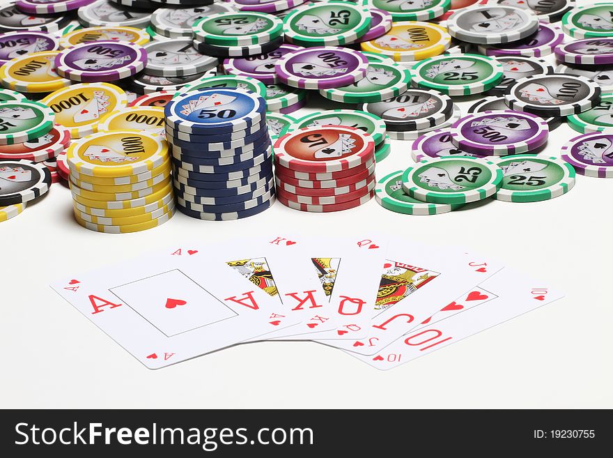 Poker cards and coins isolated on white background