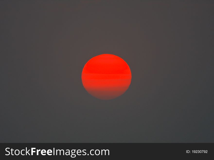 Red-orange sun in the evening