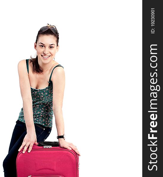 Beautiful girl with a travel bag over white background