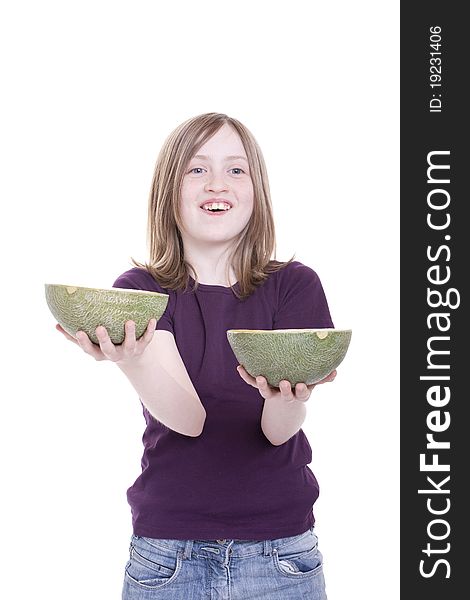 A girl holds melon halves in the hand. A girl holds melon halves in the hand