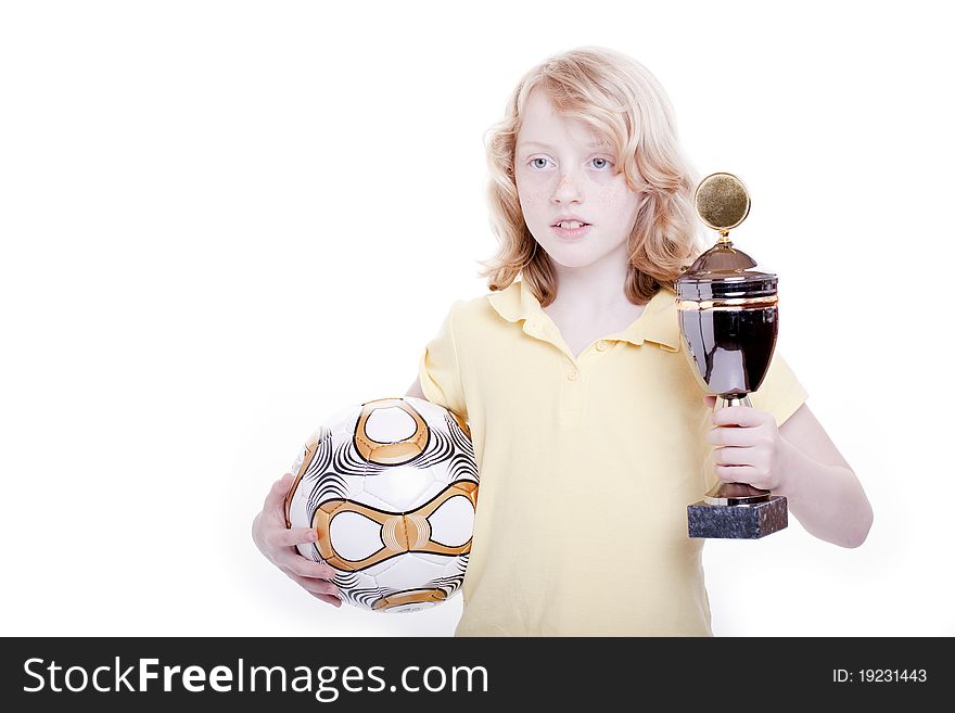 Small girl with a football and the cup in the hand. Small girl with a football and the cup in the hand