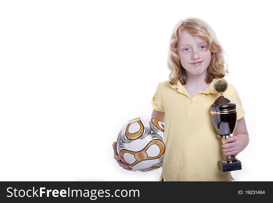 Small girl with a football and the cup in the hand. Small girl with a football and the cup in the hand