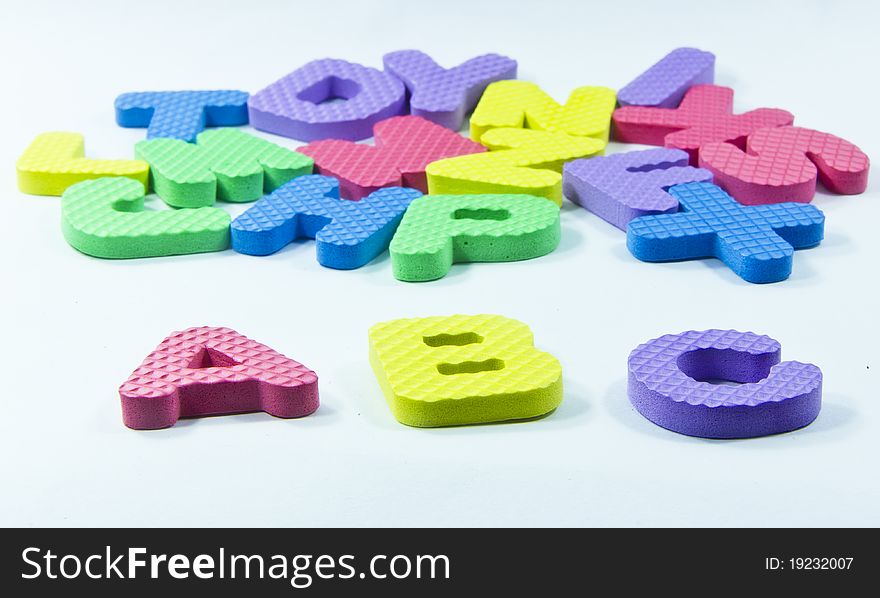 Various colour letters on white background ,