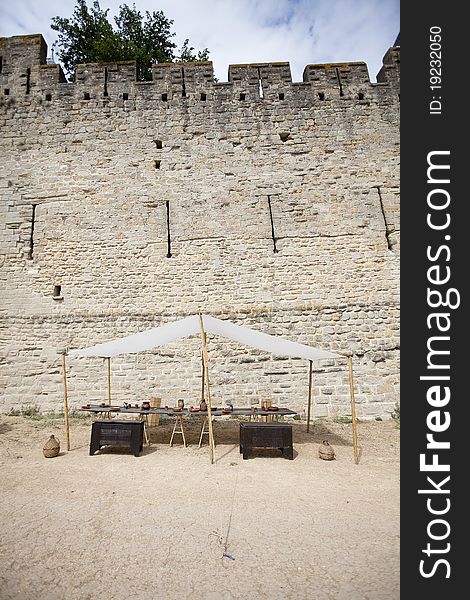 City wall of Carcassonne with market stall. City wall of Carcassonne with market stall