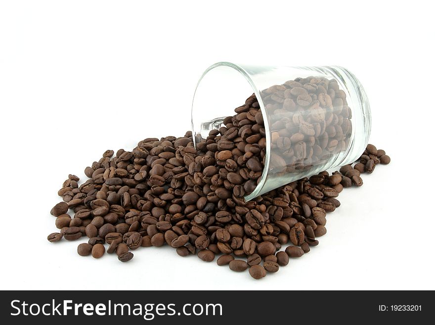 Coffee glass make scattered roasted coffee bean in white background. Coffee glass make scattered roasted coffee bean in white background