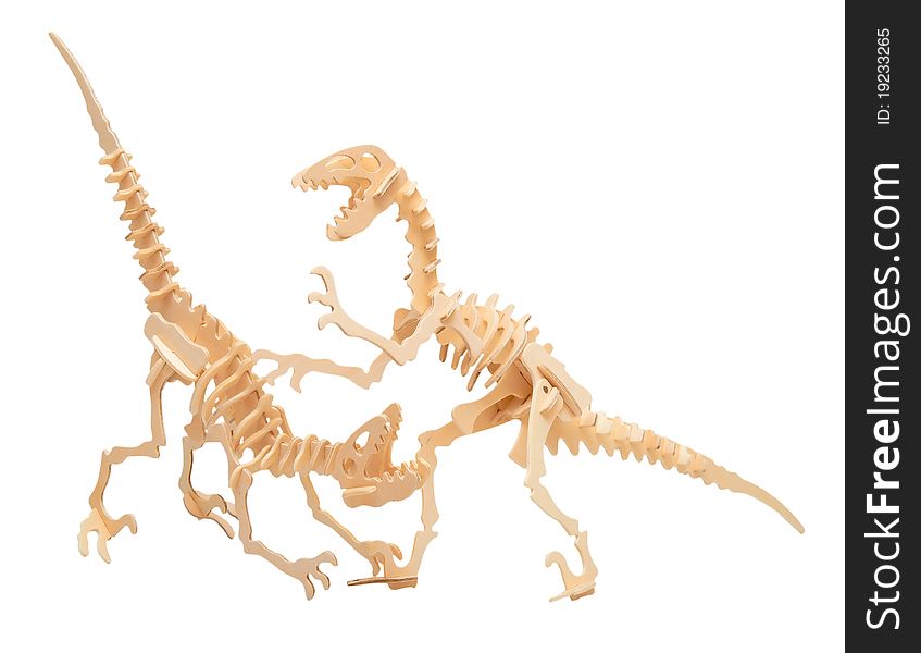 Wooden model of a dinosaurs isolated on a white background