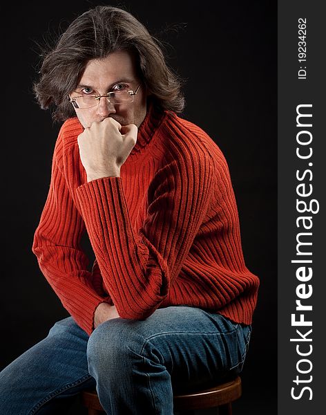 Man In Red Sweater Sitting On Chair