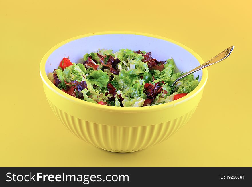 Salad in a bowl of yellow
