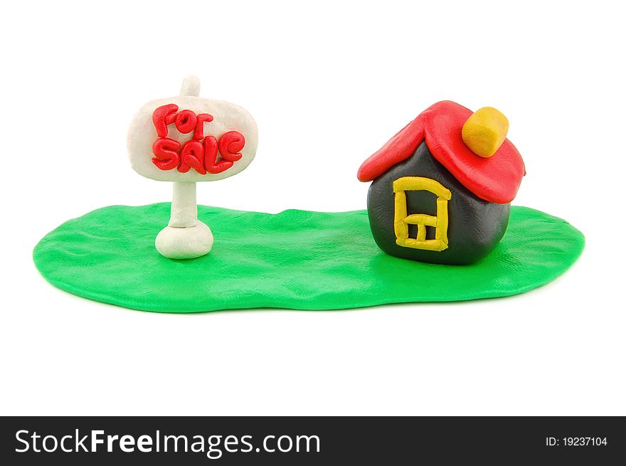 Plasticine house and For Sale real estate sign isolated on white backgroud