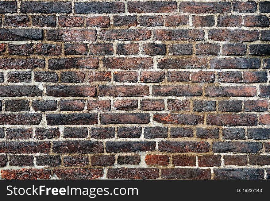 Old Wall Made Of Flamed Bricks