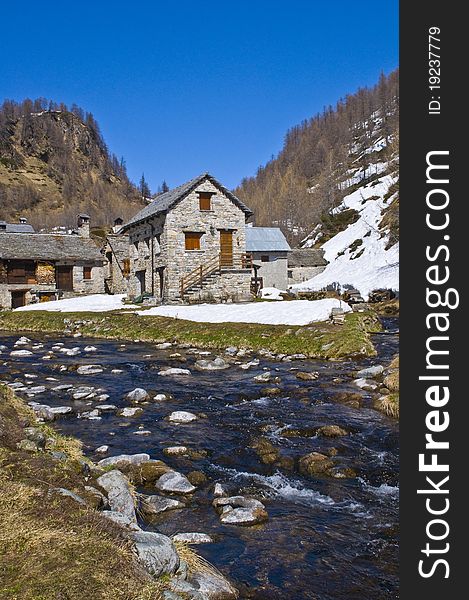 A little village in a mountain landscape. A little village in a mountain landscape