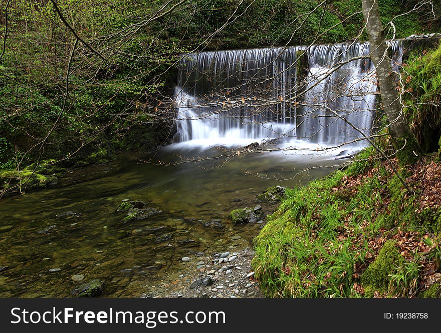 A waterfall and the surroundings of Ambleside, the lake district